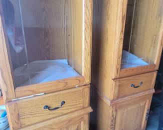 Curio cabinets with glass shelves and light