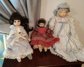 Trio of VintageStyle Porcelain Dolls in Victorian Dresses