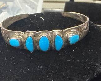 A Native American silver bracelet signed with "SM" attributed to Navajo silversmith Sheryl Martinez