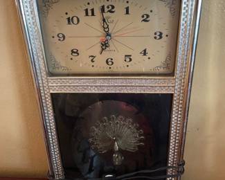 Vintage clock with peacock ornament 