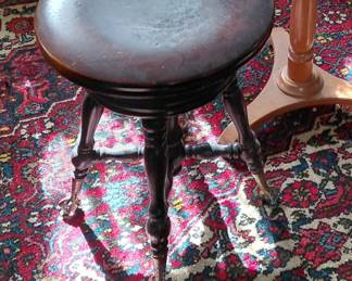 Piano stool with clawed feet on crystal balls