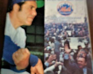 autographed program from the 1973 world series by Yogi Berra.