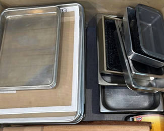 Lot 270: Assorted Baking Pans, Baking Sheets, Cooling Racks, Silicone Mats, Rolling Pins, and Flour Sifter