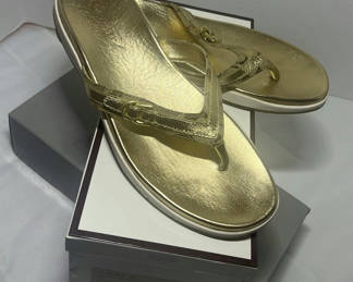 Lot 71: Coach Lyndsey Gold Thong Sandals Size 10