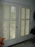 Custom wood shutters throughout.