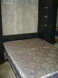 CUSTOM BUILT MURPHY BED WITH CORNER SHELF.