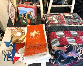 Texas/western-themed decor including quilt/wall hanging, dishtowels, coasters + lunchbox