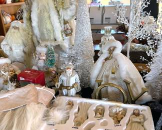 Santas, angels, snowy decor and nativity scene
