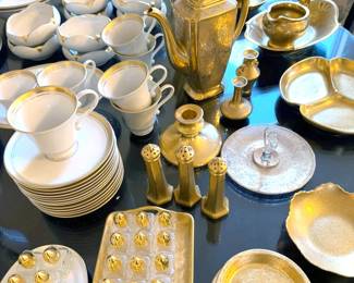 Gold-rimmed china and serving pieces