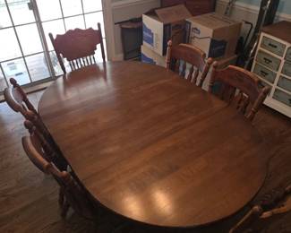 Table with 2 leaves. Only has 4 chairs great for the first house. Super sturdy 