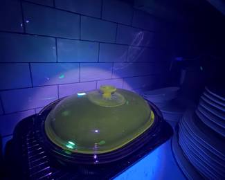 Corningware Vision Roasting Dish with green manganese glow under UV light