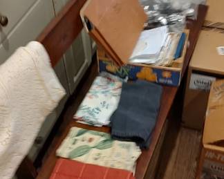 Table linens, molds, long wooden bench