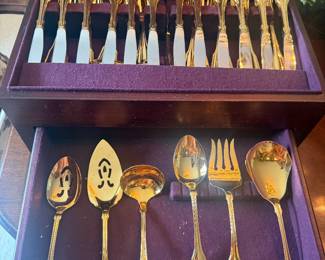 Gold plated 12 person flatware set