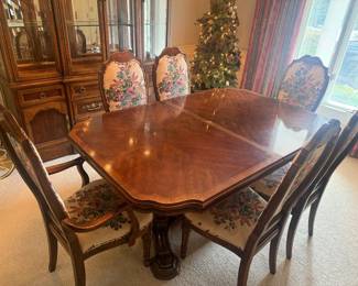 Dining table with extenders and 8 custom upholstered chairs, pre lit and decorated Christmas tree with urn