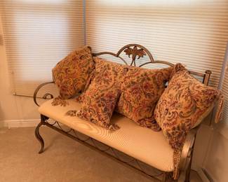 Iron settee with upholstered seat