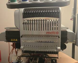 Melco EMT16X, 16-needle embroidery system A commercial-grade multi-needle embroidery machine built for production work. It handles caps, jackets, polos, bags and flat goods, and its 16 needles let you run multi-color designs without stopping to change thread. Accessories included.