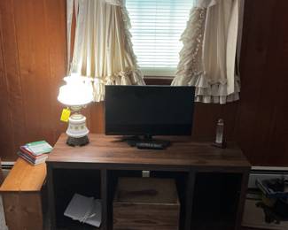 TV, lamp, oak table/bench, country curtains, etc.
