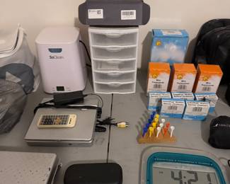 Health and personal care supplies, digital clock and sunglasses