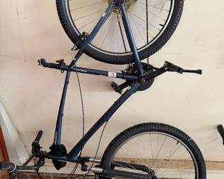 Bicycle mounted on garage wall rack
