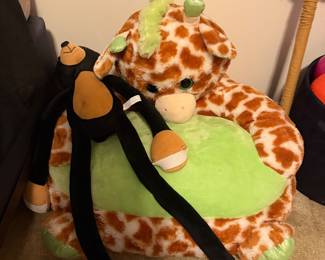 Giraffe plush childrens chair with monkey plush toy