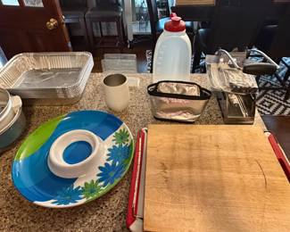 Foil baking pans, floral platter, wood cutting board and fryer basket