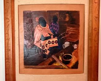 Framed art print of seated figures in carved wood frame