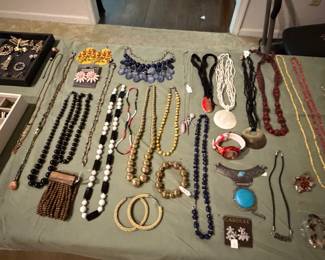 Beaded and chain necklaces, pearl strands, hoop earrings and figural brooches
