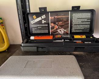Shelf with power tool cases and hardware