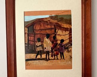 Framed print of a village scene in carved wood frame