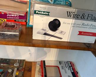 Pet supplies and hardware in original boxes on shelf