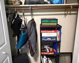 Closet with umbrellas, luggage and board games