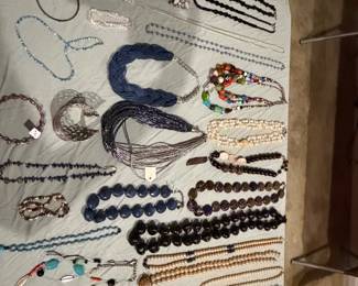 Beaded necklaces in lapis blue, black and turquoise with assorted chains and pendants