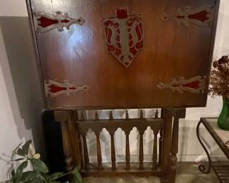Antique carved wood cabinet with decorative hardware