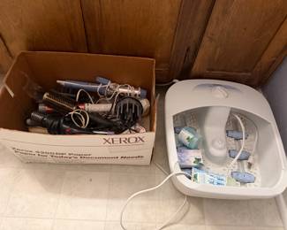 Box of hair styling tools with foot spa