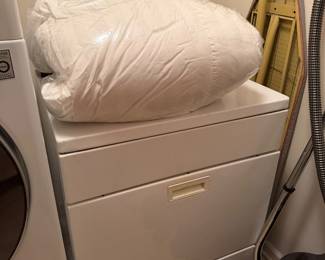Clothes dryer with bedding and upright vacuum
