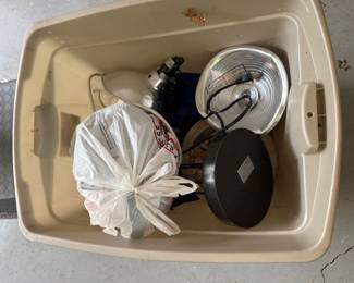 Storage tub with cookware and kitchen items