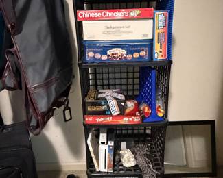 Closet organizer with backpacks, craft supplies and games
