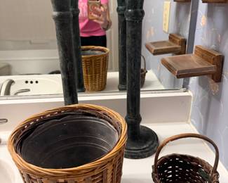 Wrought iron candlesticks with woven wicker baskets