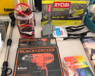 Ryobi and Black and Decker power tools with accessories