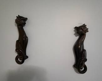 Pair of carved wood wall brackets with figural detail