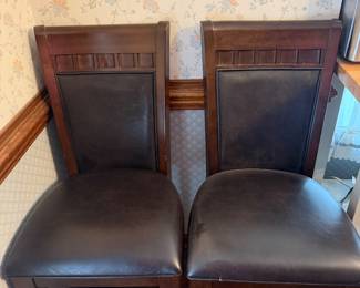 Pair of wood and brown leather upholstered dining chairs