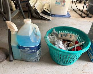 Glass cleaner and basket of cleaning supplies