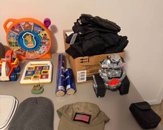 Table with childrens toys and bags