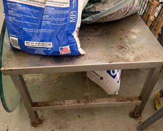 Bags of concrete mix on rolling work cart