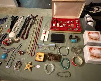 Jewelry box with rings, beaded necklaces, turquoise cuff bracelet and vintage cat eye eyeglasses