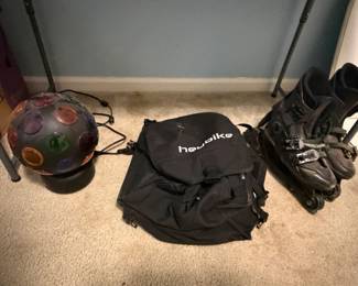 Backpack, mirrored disco ball and inline skates