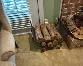 Firewood rack with split logs beside the hearth