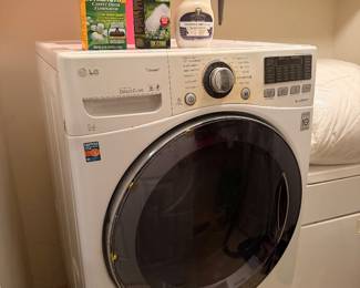 LG front loading washing machine with laundry supplies