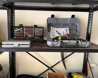 Garage shelving with hand tools, hardware and planters