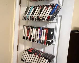 Wire rack holding VHS tape collection